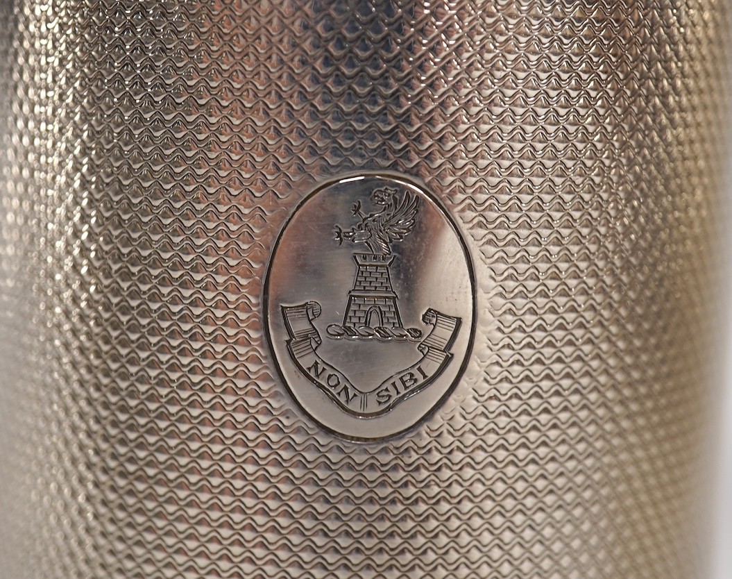 A Victorian engine turned silver christening mug by John Samuel Hunt (Hunt & Roskell), London, 1863, with later engraved inscription to the base, height 89mm, together with a George VI silver cream jug, London, 1947, 12o